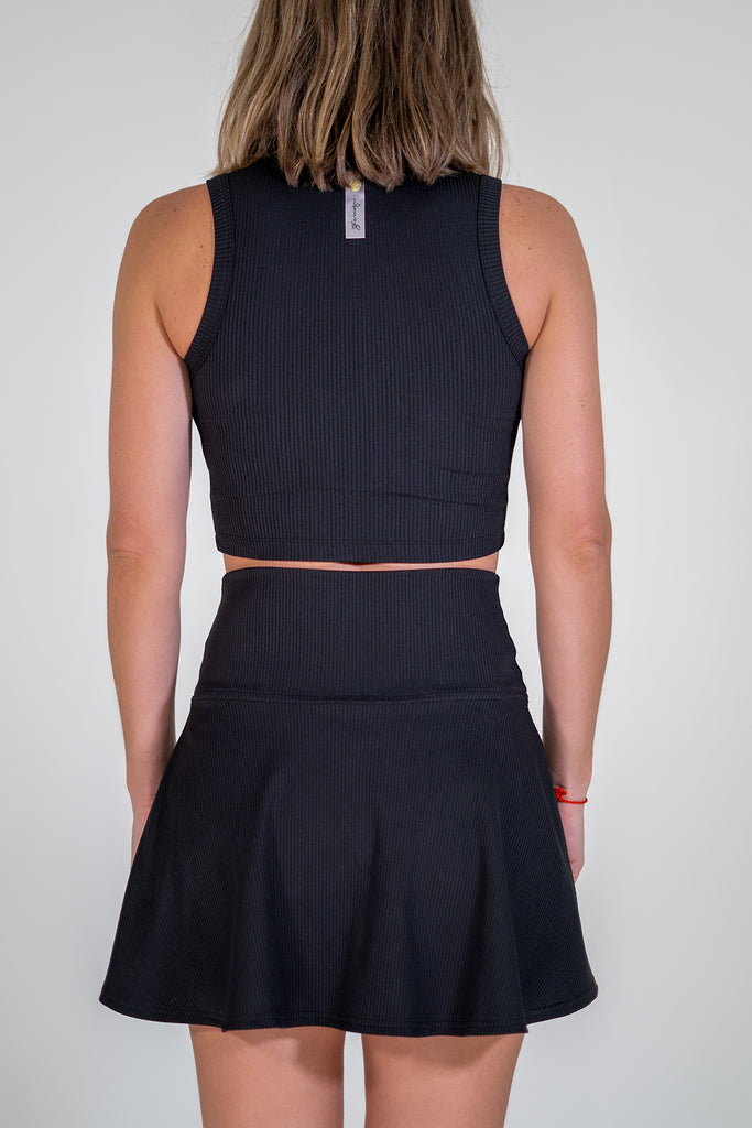 black tennis outfit with crop top and skirt back view