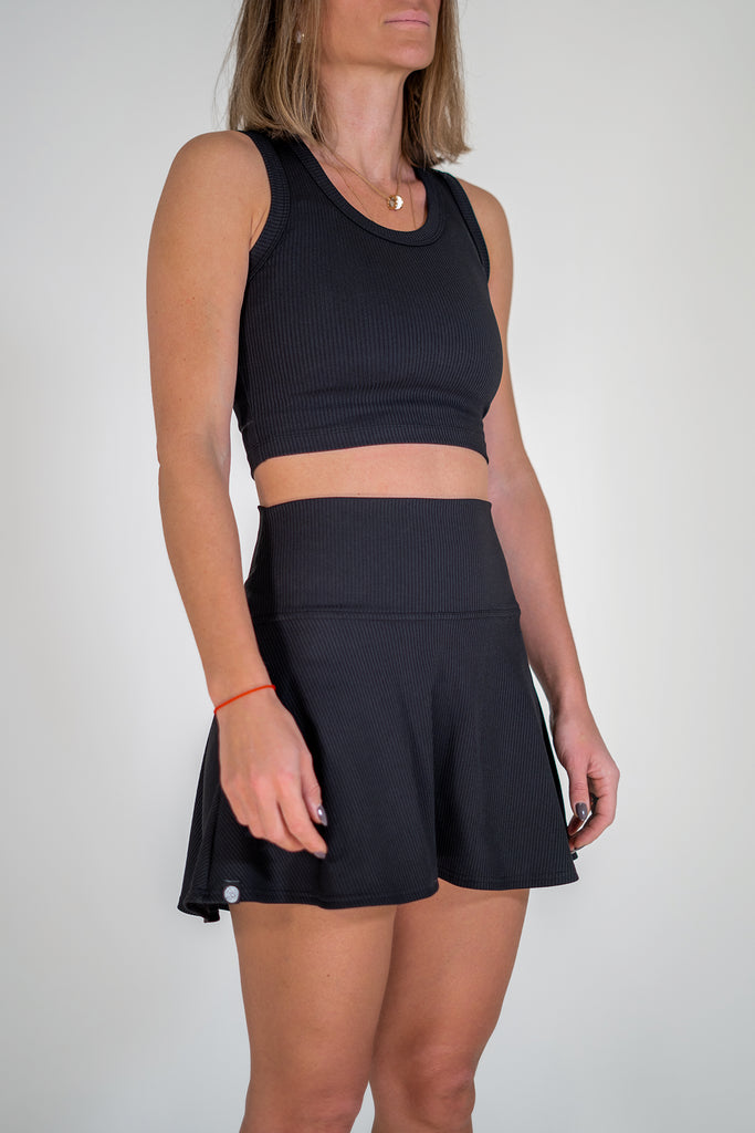 black tennis set with crop top and skirt