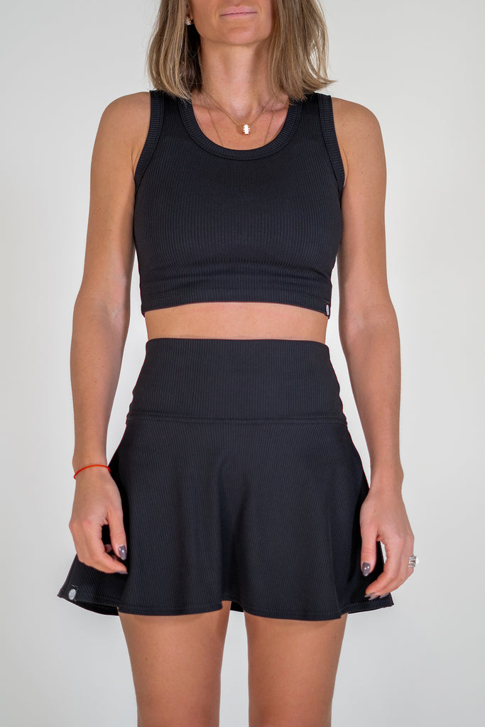 black tennis outfit with crop top and skirt