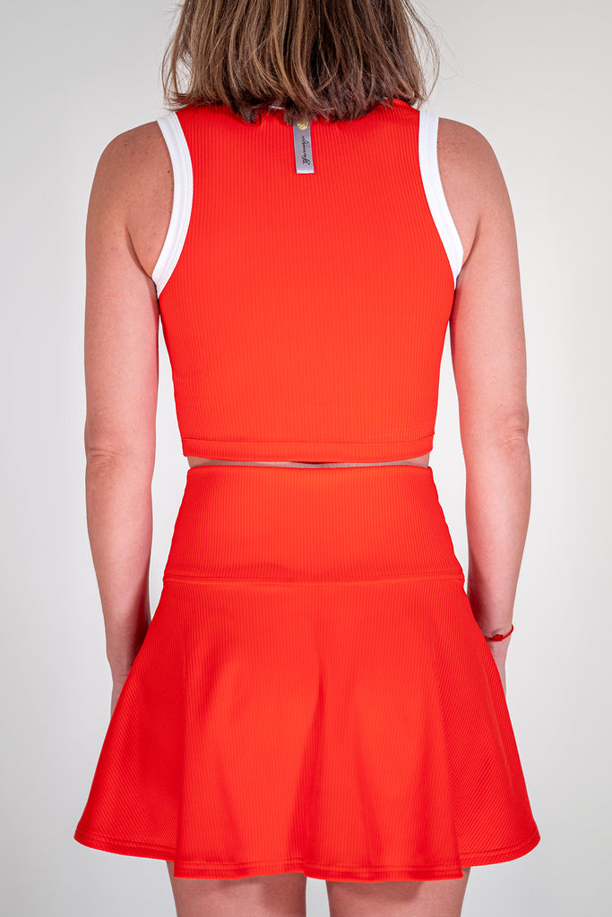 red tennis outfit with tank top and skirt