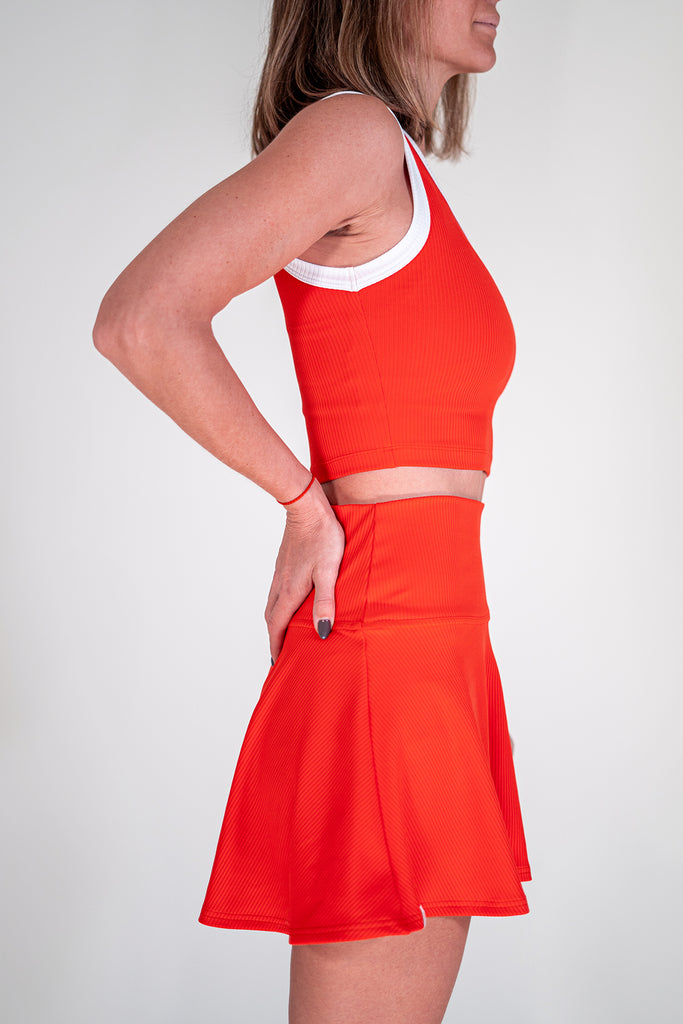 red tennis outfit with crop top and skirt