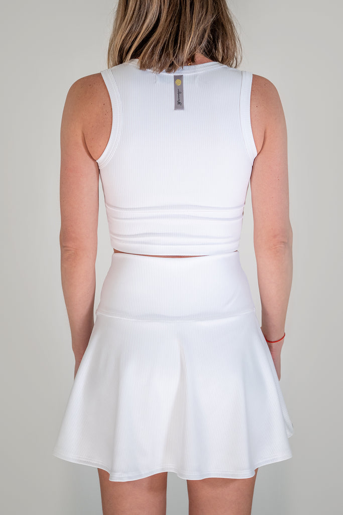 white tennis outfit with crop top and skort back view