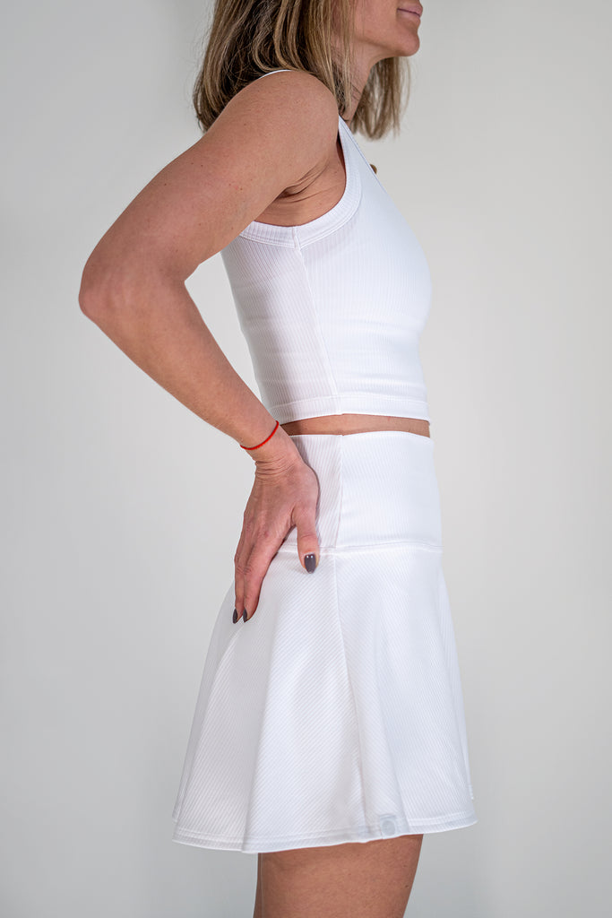 white tennis outfit with tank top and skirt